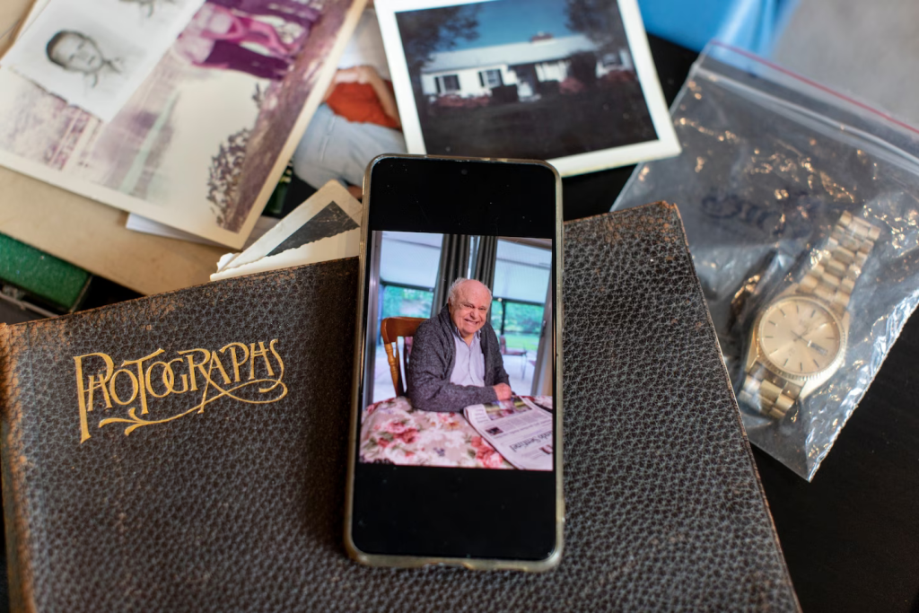 Douglas Hulse pictured on cellphone among other photos